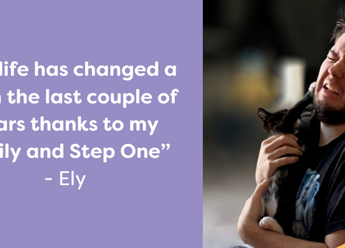 Ely, a Step One Charity service user, playing with pet cat