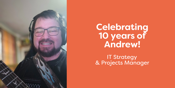 A man smiling with a guitar and a title that reads: Celebrating 10 years of Andrew! IT Strategy & Project Manager