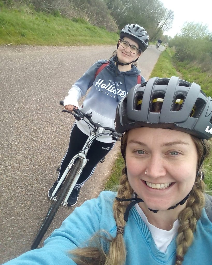 Two people on a bike ride.