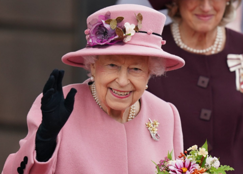 Queen Elizabeth II waving and smiling