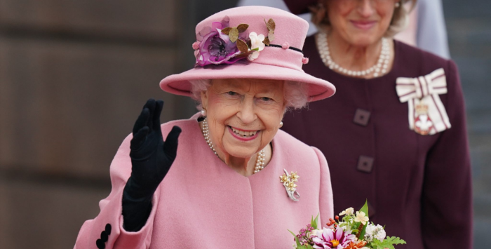 Queen Elizabeth II waving and smiling