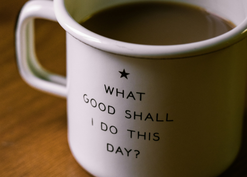 A mug of tea which says 'What good shall I do this day?' on the mug