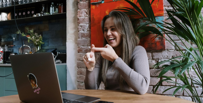 Woman talking on a laptop.