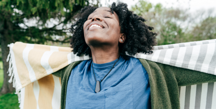 Person smiling at the sky