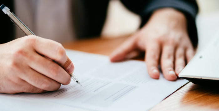 Person writing on paper