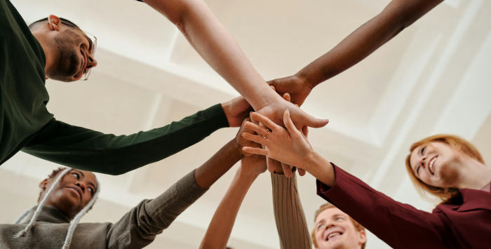 People putting their hands together